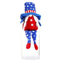 The Long-legged Faceless Doll Sits In A Plush Posture